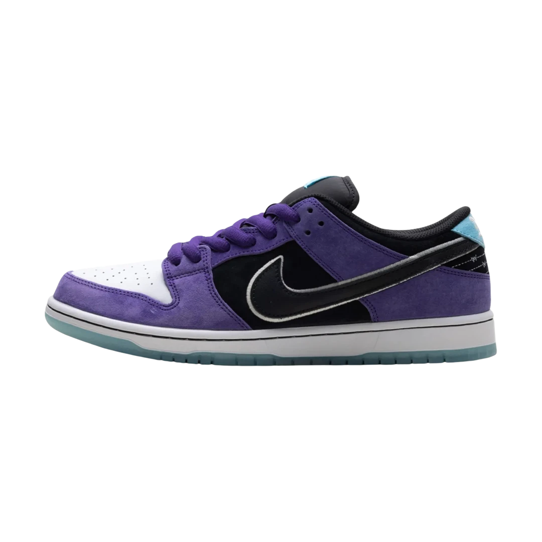 Purple and black sneaker with a white sole on a white background