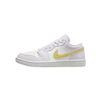 White sneaker with a gold Nike logo on a white background