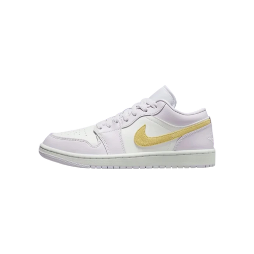 White sneaker with a gold Nike logo on a white background